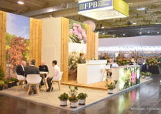 Peter Kruger of Star Roses and Plants talking with visitors.